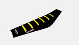 Black Guts Racing ribbed e-moto seat cover with yellow grip ribs