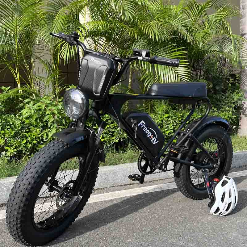 Freego E-Bike Waterproof Front Bag on a parked e-bike among palm plants