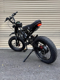 GhostCat BMX Kit F Series, black bike with BMX bars and red rear rim, rear angle