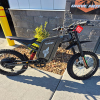 Freego X2 Pro e-moto left side profile view highlighting motor and swingarm