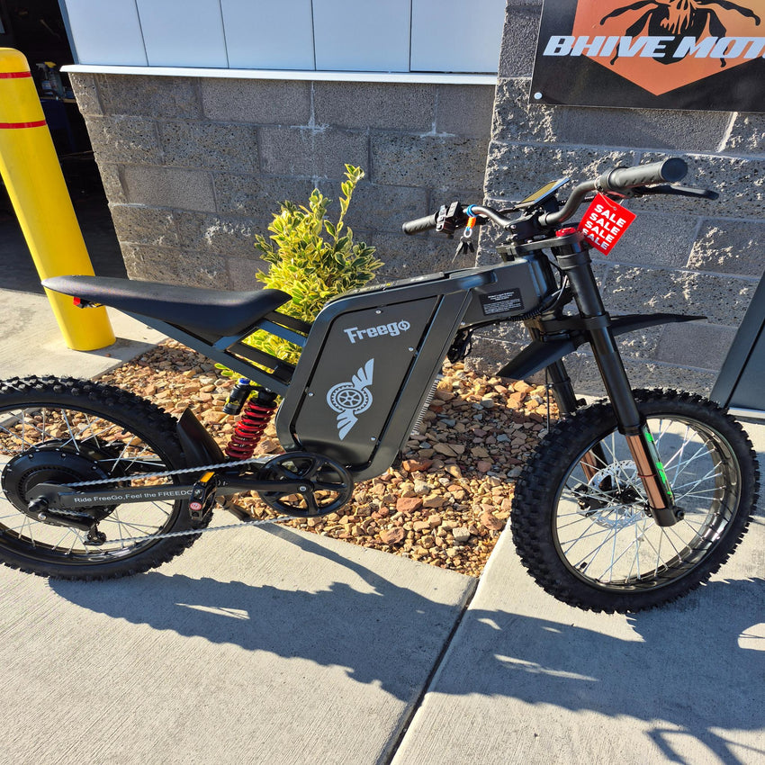 Freego X2 Pro e-moto left side profile view highlighting motor and swingarm