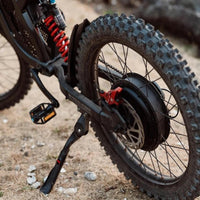 Freego X2 e-dirt bike rear angle showing swingarm and rear suspension detail