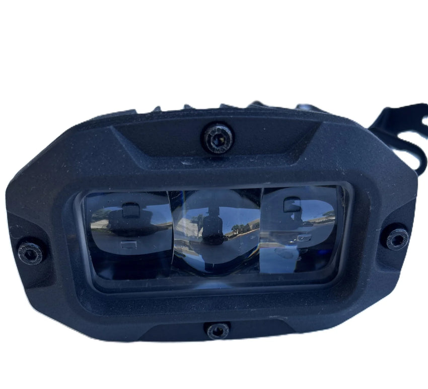 GhostCat Headlight, front view of the black triple LED lens housing