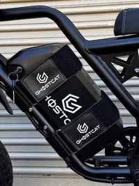 GhostCat Battery Strap, two black branded straps around the battery, side view