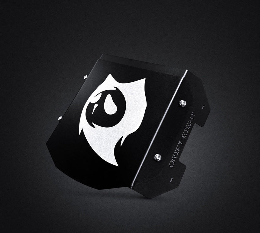 Drift Eight Metal Front Plate for GhostCat, black plate with white ghost logo on a dark background
