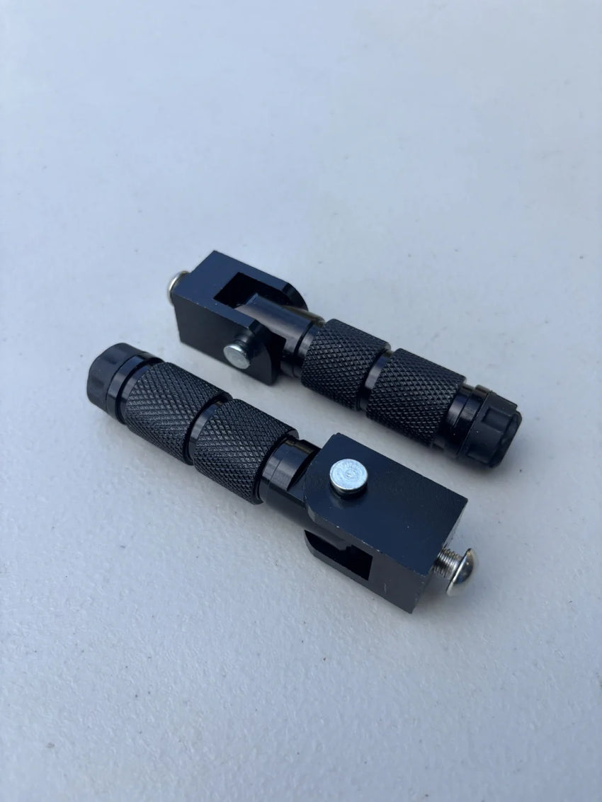 GhostCat Rear Peg Set, two black knurled foot pegs with mounts
