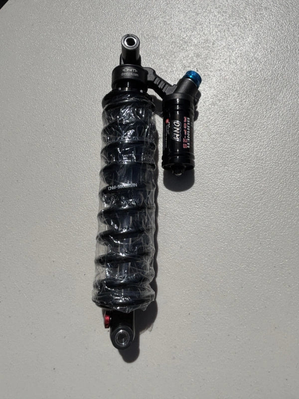 GhostCat DNM Rear Shock, black coil-over shock with reservoir, upright view