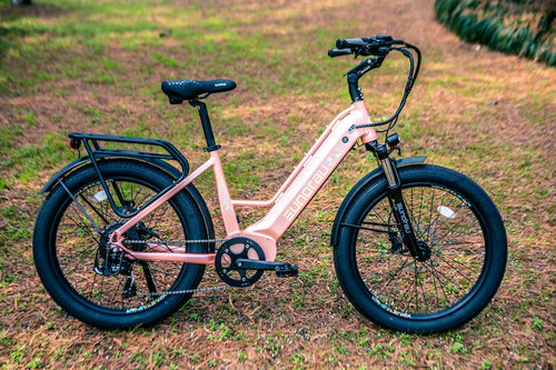 Eunorau META24 1.0 step-through e-bike in Pastel Pink parked on grass