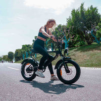 Freego DK200 fat tire e-bike ridden on a park road by a woman