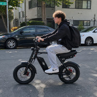 Freego Maxx M3 electric bike with a rider seated on a city street