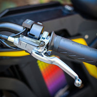 Freego Nova 4 electric dirt bike brake lever and handlebar switch close-up