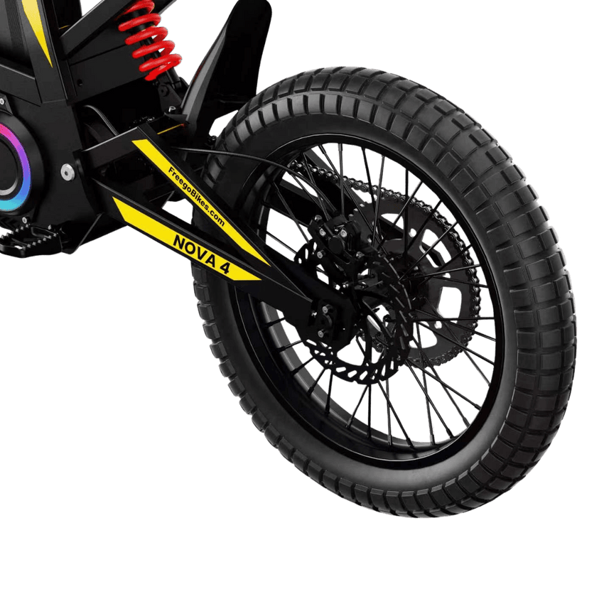 Freego Nova 4 electric dirt bike rear wheel, red shock and disc brake close-up