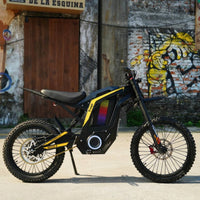 Freego Nova 4 electric dirt bike parked on its stand by a graffiti wall