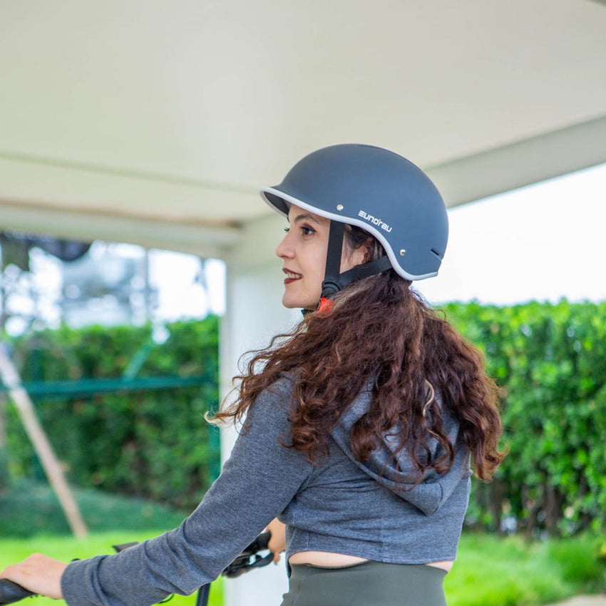 Rider wearing the Genesis helmet on an e-bike